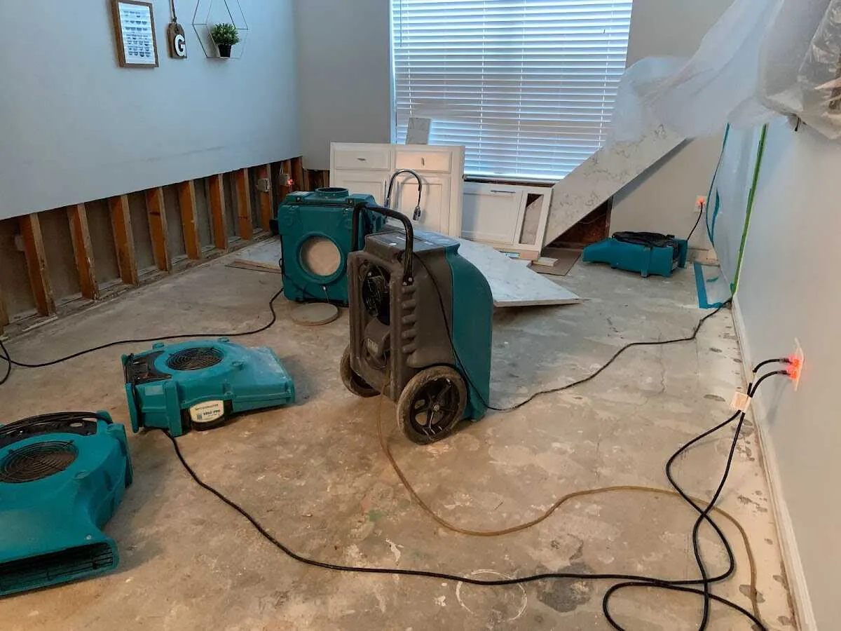 Dehumidifier in flood-cut room for Water Damage Restoration in The Crossings